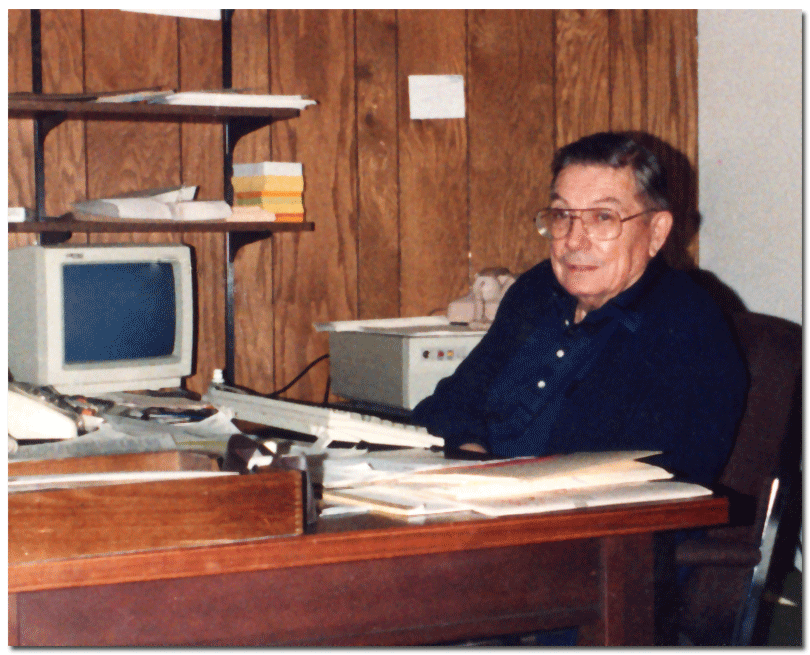 John Weinard at the reception desk in his Clinton Avenue, Minneapolis office, in the late 1980s.